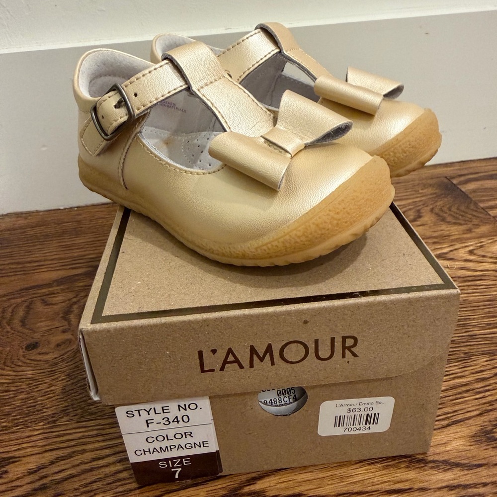 Size 7 L'Amour Girls' Champagne Bow Strap Dress Shoes worn maybe twice excellent